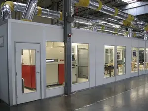 Machine Enclosure cleanroom within a warehouse with large viewing windows
